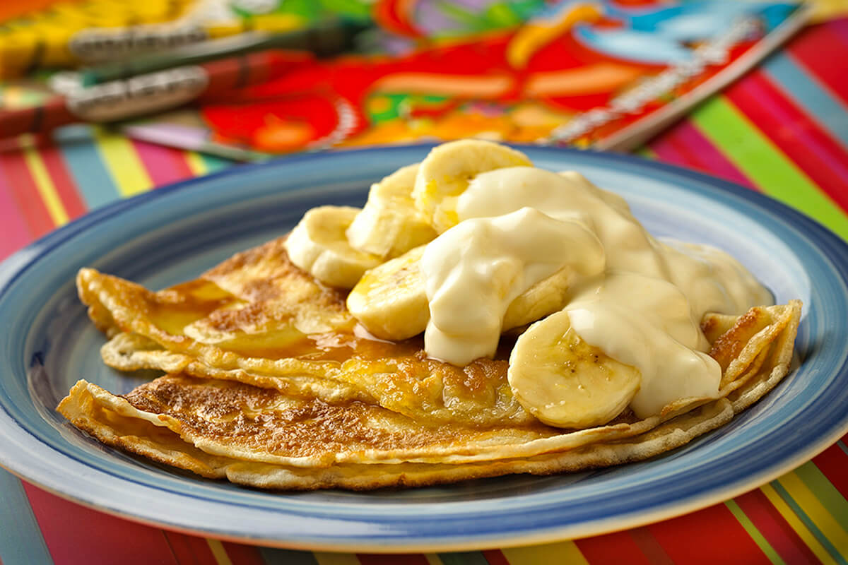Pancakes served with Banana Slices and Mango Papaya & Passion Fruit Yogurt - Onken Onken